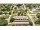 Aerial view of a community featuring a swimming pool, mature trees, and well-maintained landscaping at 904 Michigan Ave, St Cloud, FL 34769