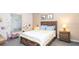 Bedroom with wood bed frame, window with blinds, and light walls at 904 Michigan Ave, St Cloud, FL 34769
