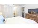 Bedroom with white walls, closets, and view into hall at 904 Michigan Ave, St Cloud, FL 34769