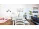 Bright dining space featuring hardwood floors, stylish decor, comfortable seating, and plenty of natural light at 904 Michigan Ave, St Cloud, FL 34769