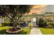 Charming home exterior featuring a delightful patio area, perfect for outdoor relaxation and enjoyment of the beautiful sunset at 904 Michigan Ave, St Cloud, FL 34769