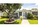 Charming home exterior featuring a delightful patio area, perfect for outdoor relaxation and a lovely landscaped yard at 904 Michigan Ave, St Cloud, FL 34769