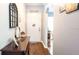 Entryway featuring hardwood floors, stylish decor, and a welcoming ambiance for guests at 904 Michigan Ave, St Cloud, FL 34769
