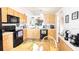 Functional kitchen featuring wood cabinets, modern appliances, ample counter space, and cozy dining area at 904 Michigan Ave, St Cloud, FL 34769