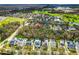 Picturesque aerial view of a residential area near a golf course and green spaces at 933 Jasmine St, Celebration, FL 34747