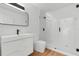 Modern bathroom featuring a glass shower, sleek vanity, and contemporary fixtures at 933 Jasmine St, Celebration, FL 34747