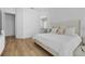 Bright bedroom with a large bed, ensuite bathroom, and light wood flooring at 933 Jasmine St, Celebration, FL 34747