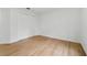 A bedroom with wood-look flooring, white walls and a double door closet at 933 Jasmine St, Celebration, FL 34747