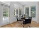 Bright dining area with modern chairs, a sleek table, and a view to the yard at 933 Jasmine St, Celebration, FL 34747
