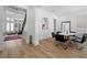 Modern dining area with hardwood floors, a round table, and contemporary black chairs at 933 Jasmine St, Celebration, FL 34747