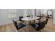 Bright dining room with a sleek table, modern chairs, and hardwood flooring at 933 Jasmine St, Celebration, FL 34747