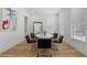 Contemporary dining room featuring a round table, black chairs, and natural light at 933 Jasmine St, Celebration, FL 34747