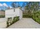 The detached garage features a 2-car garage and a separate entrance with a lush landscape at 933 Jasmine St, Celebration, FL 34747
