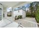 A view of the property from the porch, showcasing the detached garage and driveway at 933 Jasmine St, Celebration, FL 34747