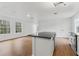 Spacious kitchen with island, natural light, granite countertops, and stainless steel appliances, great for entertaining at 933 Jasmine St, Celebration, FL 34747