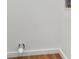 Bright laundry area features white walls, wood-look flooring and water hookups at 933 Jasmine St, Celebration, FL 34747