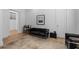 Stylish living room with a black sofa and a small bar area at 933 Jasmine St, Celebration, FL 34747