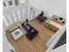 Open-concept living room with large windows, wood floors, and modern furnishings, perfect for entertaining at 933 Jasmine St, Celebration, FL 34747