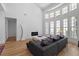 Bright living room with a modern fireplace, stylish sofa, and large windows at 933 Jasmine St, Celebration, FL 34747