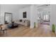 Open-concept living area with hardwood floors, modern furnishings, and plenty of natural light at 933 Jasmine St, Celebration, FL 34747