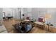 Elegant living room with hardwood floors, stylish seating, and modern black coffee table at 933 Jasmine St, Celebration, FL 34747