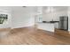 Spacious living room and kitchen combination with ample natural light, sleek countertops, and modern appliances at 933 Jasmine St, Celebration, FL 34747