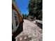 The brick paver patio has a hammock for relaxation, great landscaping, and an orange house at 10207 Cody Ln, Orlando, FL 32825