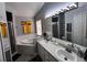 This bathroom features a dual sink vanity, a large mirror, and a separate bathtub at 10207 Cody Ln, Orlando, FL 32825