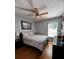 Bedroom with wooden floors and ceiling fan at 10207 Cody Ln, Orlando, FL 32825