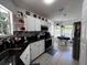 Bright kitchen with granite countertops, stainless appliances, and tiled backsplash at 10207 Cody Ln, Orlando, FL 32825