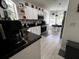 Bright kitchen with granite countertops, stainless appliances, and tiled backsplash at 10207 Cody Ln, Orlando, FL 32825