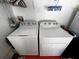 The laundry room features matching top load washing machine and electric dryer at 10207 Cody Ln, Orlando, FL 32825