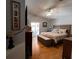 This main bedroom features a vaulted ceiling, sliding glass doors, and hardwood floors at 10207 Cody Ln, Orlando, FL 32825