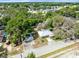 Wide aerial view of the property showing its location, the house, the garage and the surrounding neighborhood at 1101 Oregon Ave, St Cloud, FL 34769