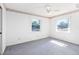 Bright bedroom featuring two windows and ample natural light at 1101 Oregon Ave, St Cloud, FL 34769