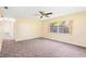 Comfortable bedroom with a ceiling fan, neutral walls, and spacious layout with attached bathroom at 1101 Oregon Ave, St Cloud, FL 34769