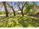 Charming home with mature trees and a fenced yard, offering a peaceful and inviting curb appeal at 1101 Oregon Ave, St Cloud, FL 34769