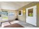 Covered porch with white door and screen door that allows lots of light at 1101 Oregon Ave, St Cloud, FL 34769