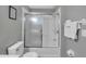 Clean, modern bathroom featuring a shower-tub combo with sliding doors and fresh white towels at 1129 Park Ridge Cir, Kissimmee, FL 34746
