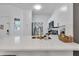 Bright, modern kitchen with white cabinets, quartz countertops, and gold hardware at 1129 Park Ridge Cir, Kissimmee, FL 34746