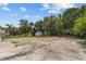 Large backyard featuring a patch of dirt and mature trees; great potential for landscaping and recreation at 1158 Stroupe Rd, Kissimmee, FL 34744