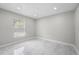 Bright bedroom with marble floors, neutral paint, and large window, offering natural light at 1158 Stroupe Rd, Kissimmee, FL 34744