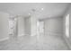 Large bedroom with recessed lighting, marble floors and a view of the hallway at 1158 Stroupe Rd, Kissimmee, FL 34744