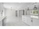 Bright kitchen with marble floors, recessed lighting, and white breakfast bar at 1158 Stroupe Rd, Kissimmee, FL 34744