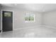 Bright, airy living room with sleek marble floors, recessed lighting, and a modern entryway at 1158 Stroupe Rd, Kissimmee, FL 34744