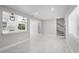 Bright open-concept home featuring modern lighting, a staircase, and marble tile flooring at 1158 Stroupe Rd, Kissimmee, FL 34744