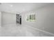 Bright living room features marble floors, recessed lighting, and view of front yard at 1158 Stroupe Rd, Kissimmee, FL 34744