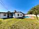 A charming backyard featuring a refreshing in-ground pool and a lush green lawn at 1211 Lehigh St, Kissimmee, FL 34744