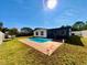 The backyard includes a pool, green lawn, and white fence at 1211 Lehigh St, Kissimmee, FL 34744
