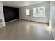 Bright, airy living room featuring neutral tile flooring, a bay window, and a modern accent wall at 1211 Lehigh St, Kissimmee, FL 34744